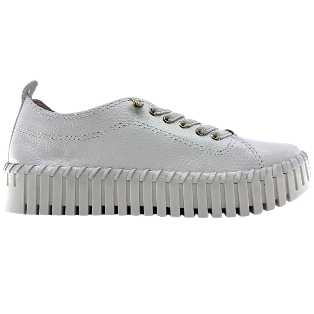 Cream leather sneaker on a white background