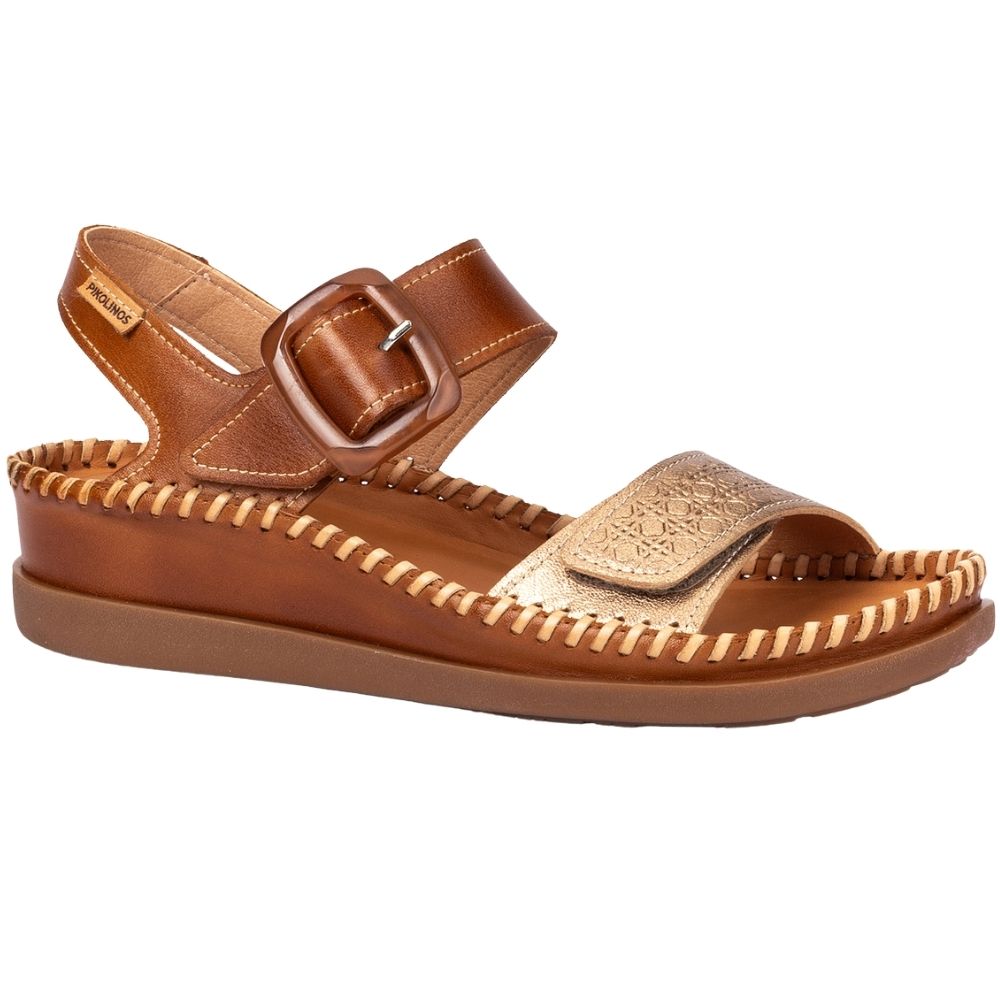 A single brown leather sandal with a buckle strap and a textured metallic gold toe strap, shown from a side profile on a white background.