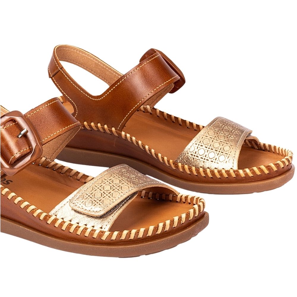 A pair of women's leather sandals in warm brown with metallic gold straps featuring a geometric pattern, shown on a plain white background.