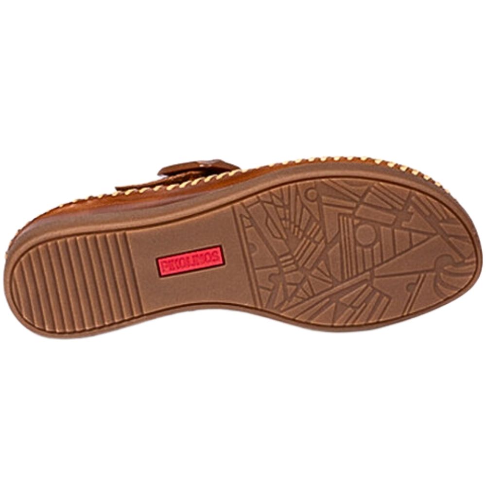 The brown rubber outsole of a sandal, featuring a textured tread pattern and a small red brand label that reads 'PIKOLINOS'.