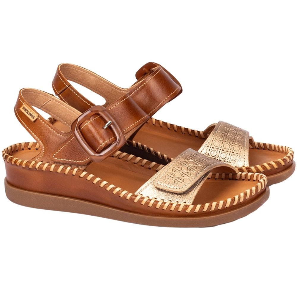 A pair of women's flat sandals in brown leather with metallic gold straps, shown on a plain white background.