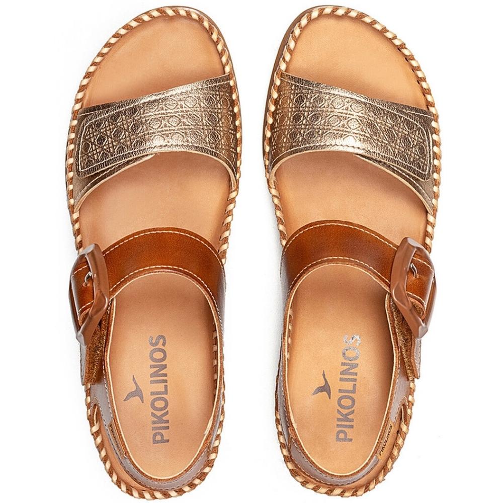 A pair of Pikolinos women's sandals shown from a top-down view. The sandals feature gold metallic embossed straps, a medium brown leather ankle strap with a buckle, and a braided rand detail on a white background.