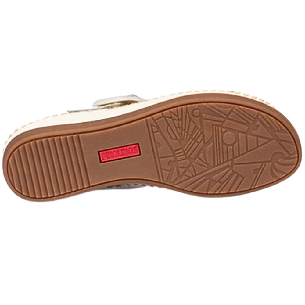 The outsole of a sandal, showing a brown textured rubber tread with a small red brand label that reads 'PIKOLINOS'.