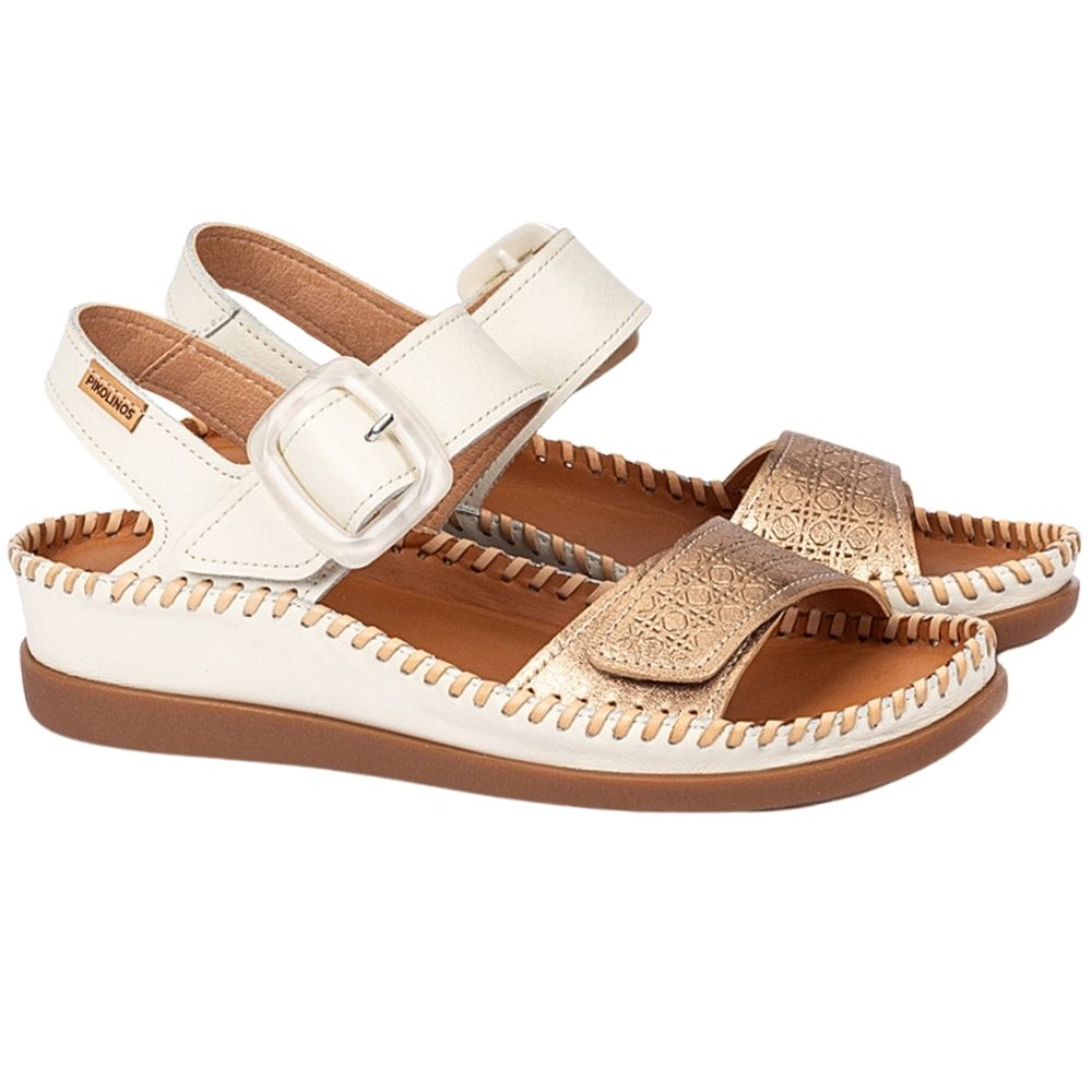 A pair of women's casual sandals with off-white straps, a metallic gold textured toe strap, and a brown sole, shown on a white background.