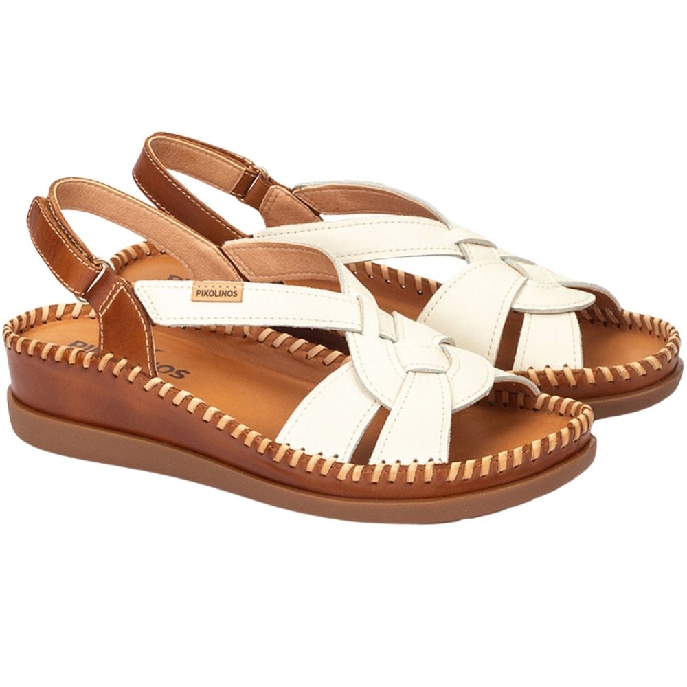 A pair of Pikolinos women's wedge sandals featuring off-white leather woven straps and a brown leather footbed and sole, shown against a plain white background.