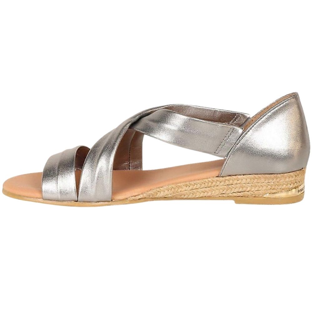A metallic pewter espadrille sandal with crisscrossing straps, a braided jute wedge heel, and a tan footbed, shown from a side profile view on a white background.