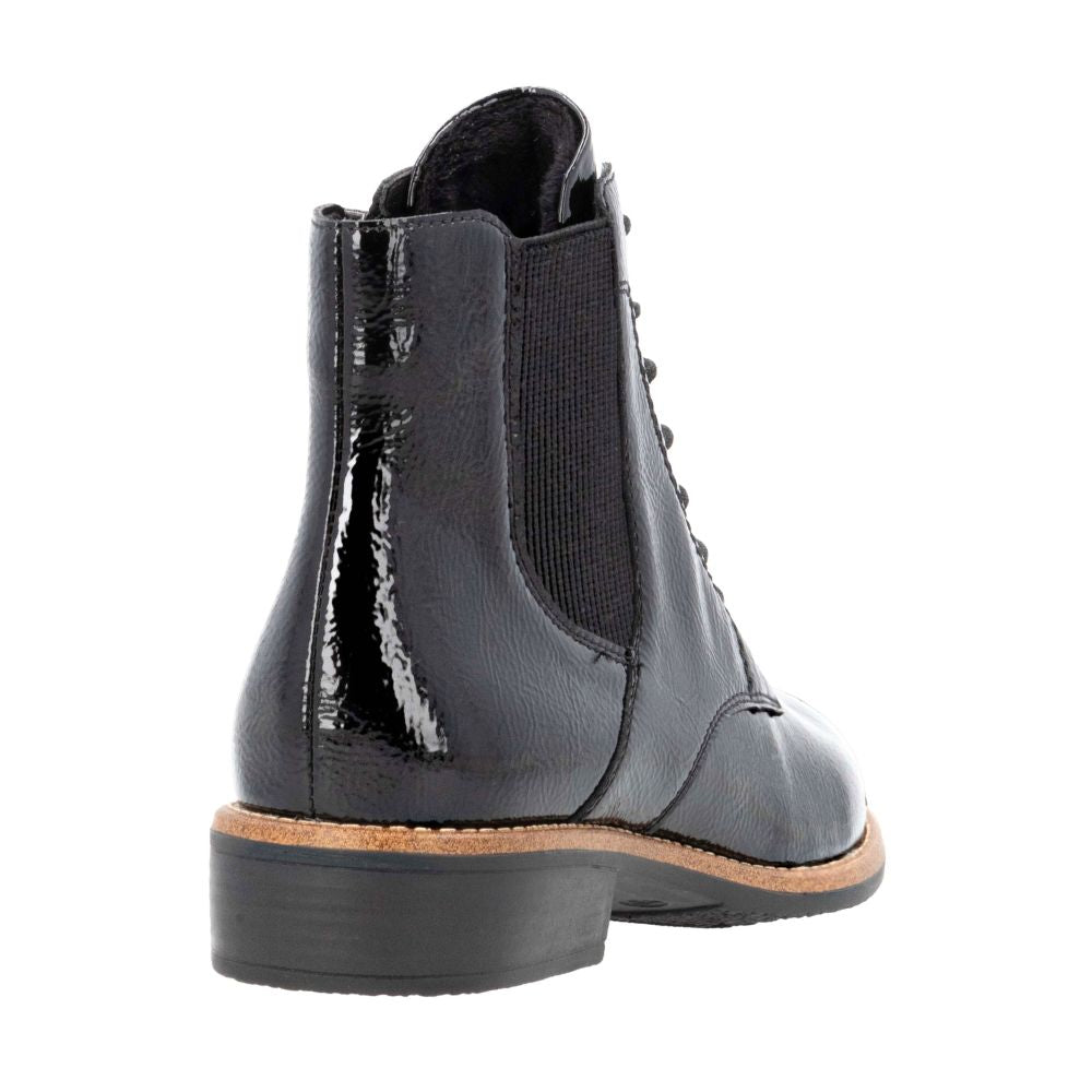 Black patent leather boot on a white background