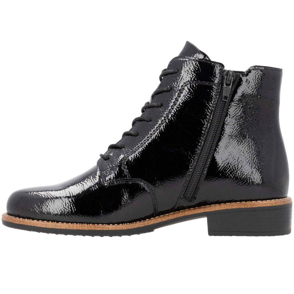 Black patent leather boot with a zipper on a white background