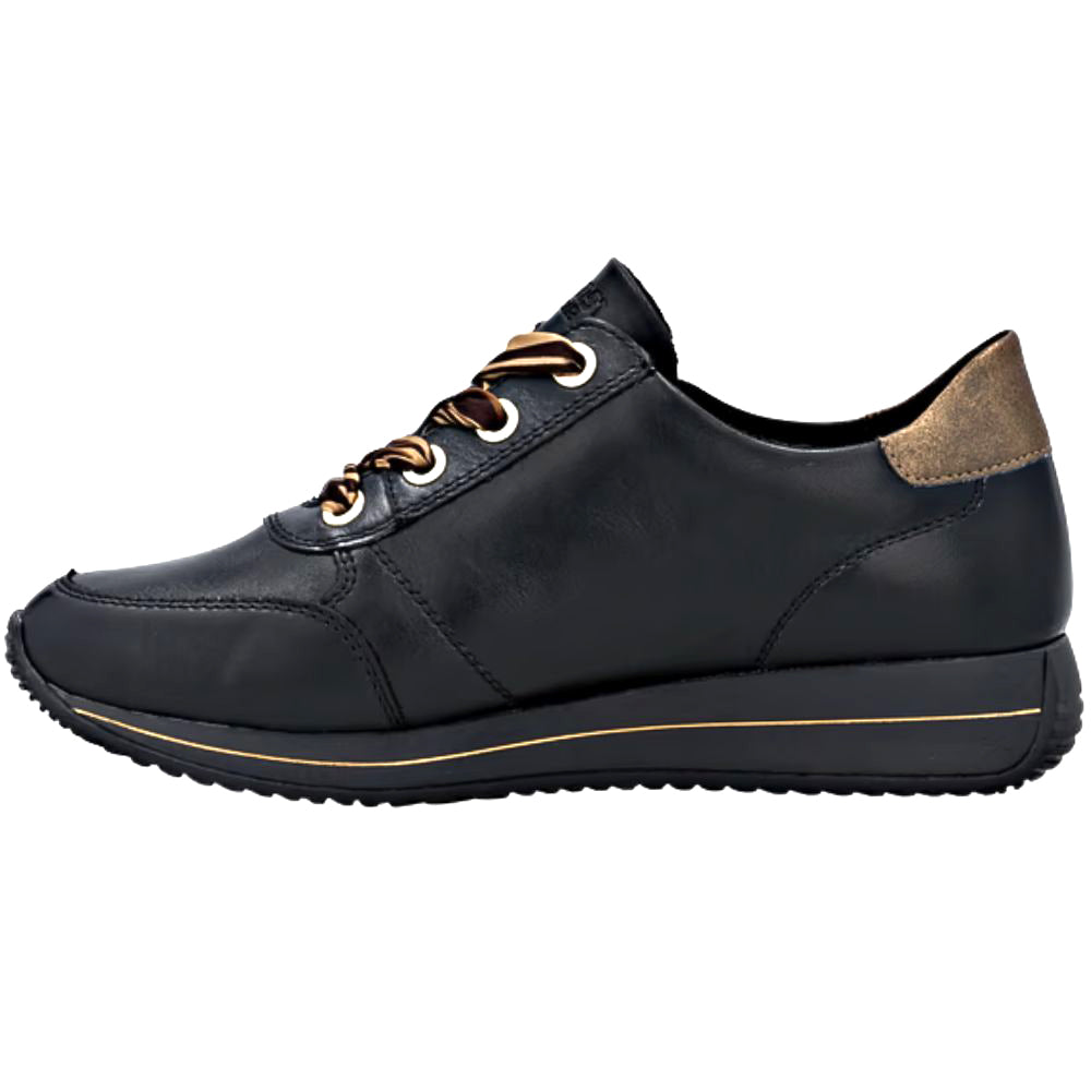 Black leather shoe with gold accents and striped laces on a white background