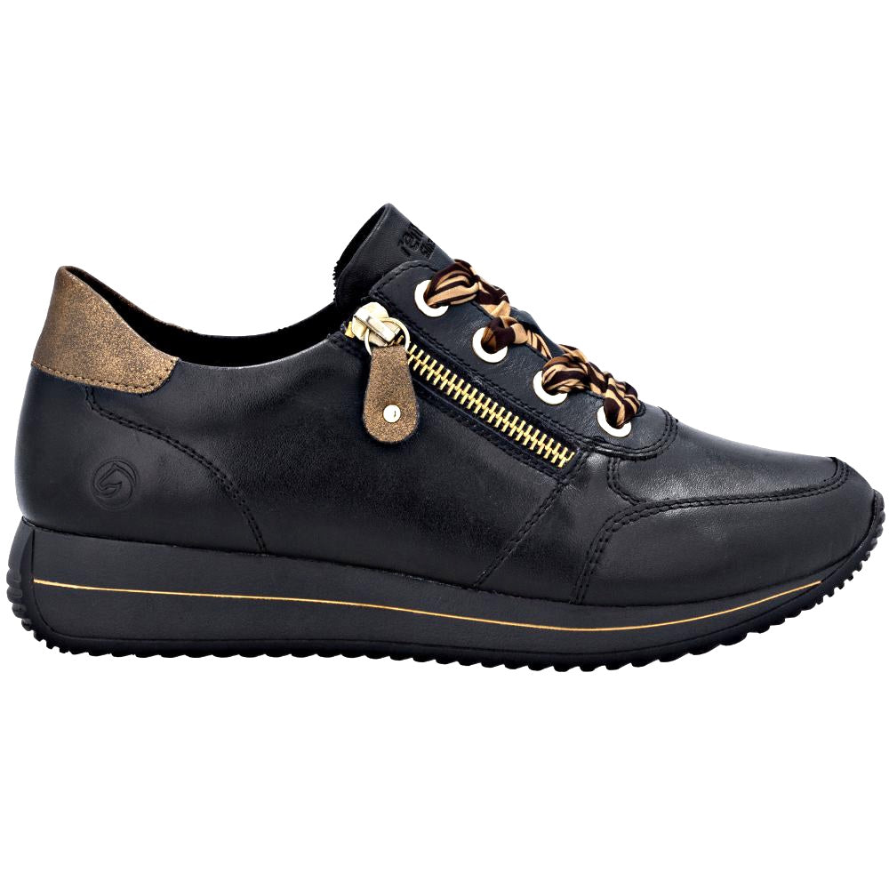 Black leather shoe with metallic accents on a white background