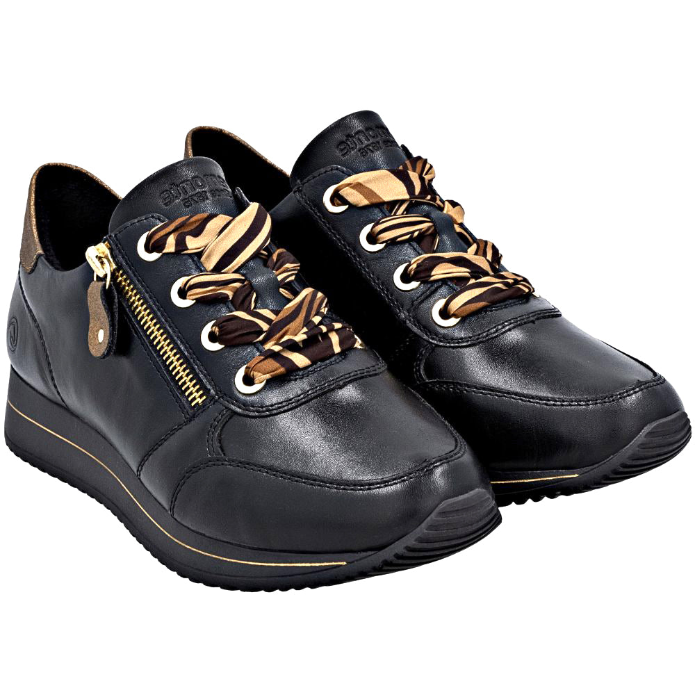 Black sneakers with metallic accents and striped laces on a white background