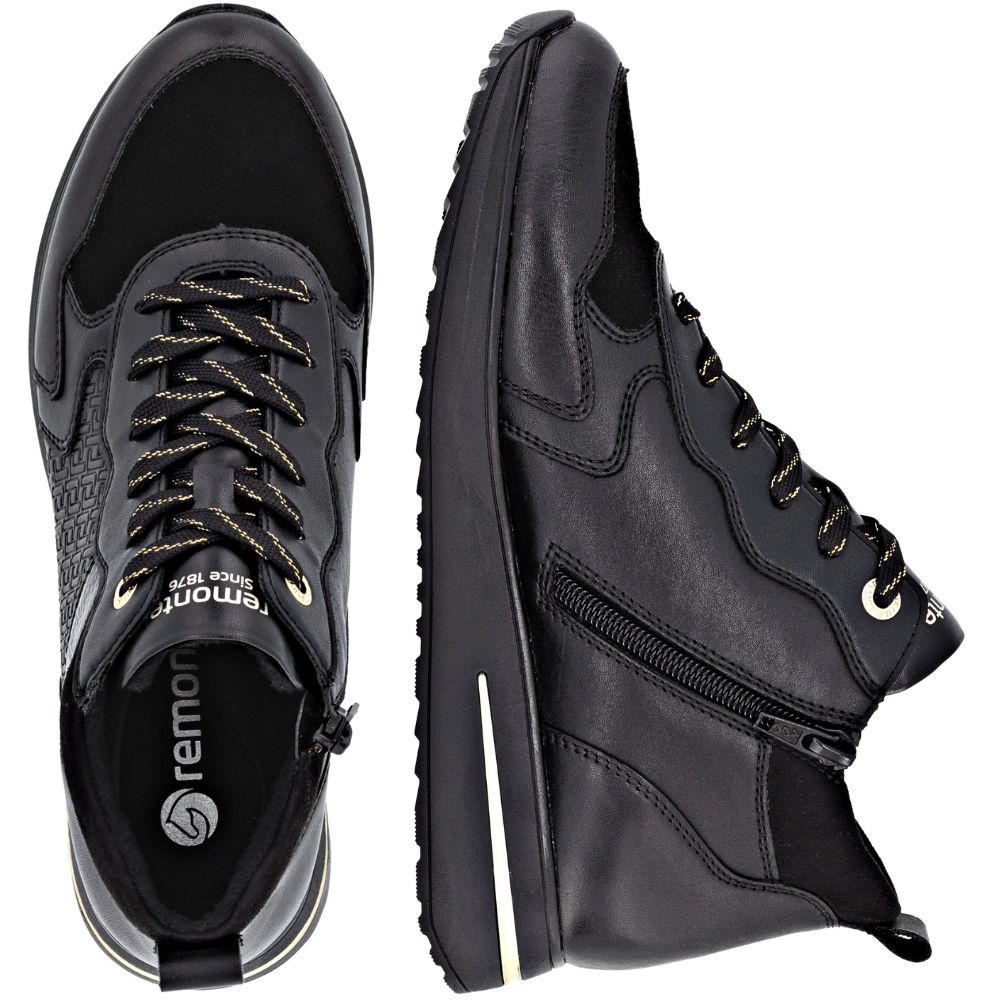 Black leather shoes with zippers and laces on a white background