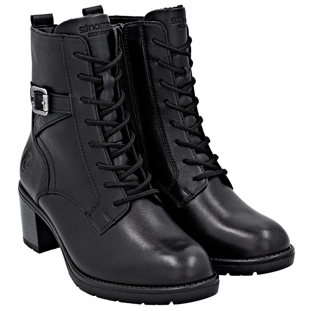 Pair of black leather boots with a buckle on a white background