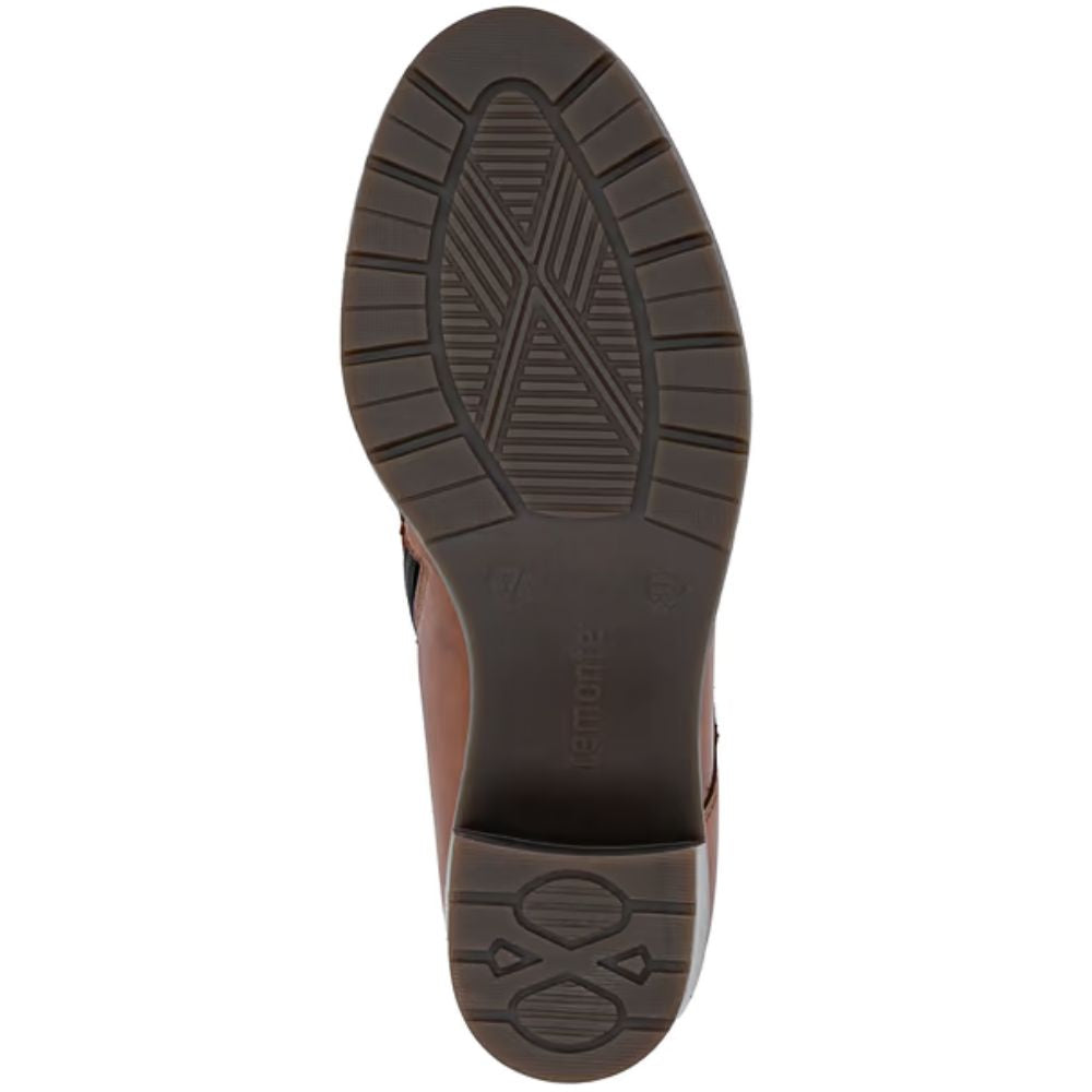 Brown shoe sole with brand logo on a white background