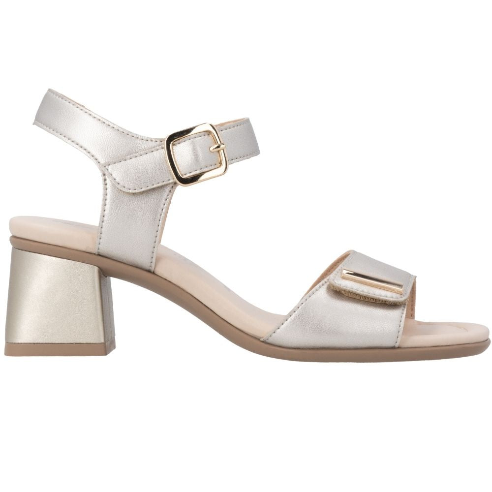 A single women's block-heel sandal in a light champagne satin finish, featuring an ankle strap with a gold-tone buckle and a matching toe strap with a small gold accent, shown against a plain white background.