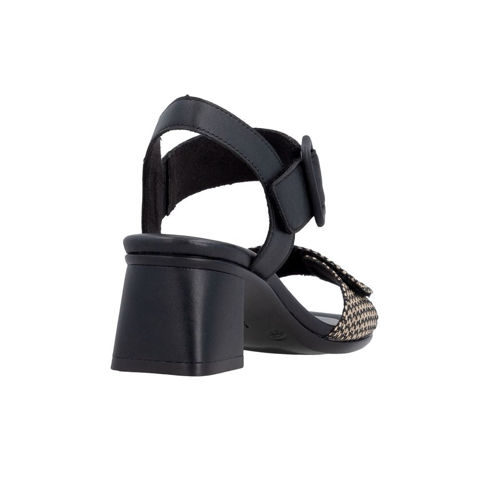 A single black block-heel sandal with an ankle strap and a woven beige and black patterned toe strap, shown from a rear three-quarter angle on a white background.