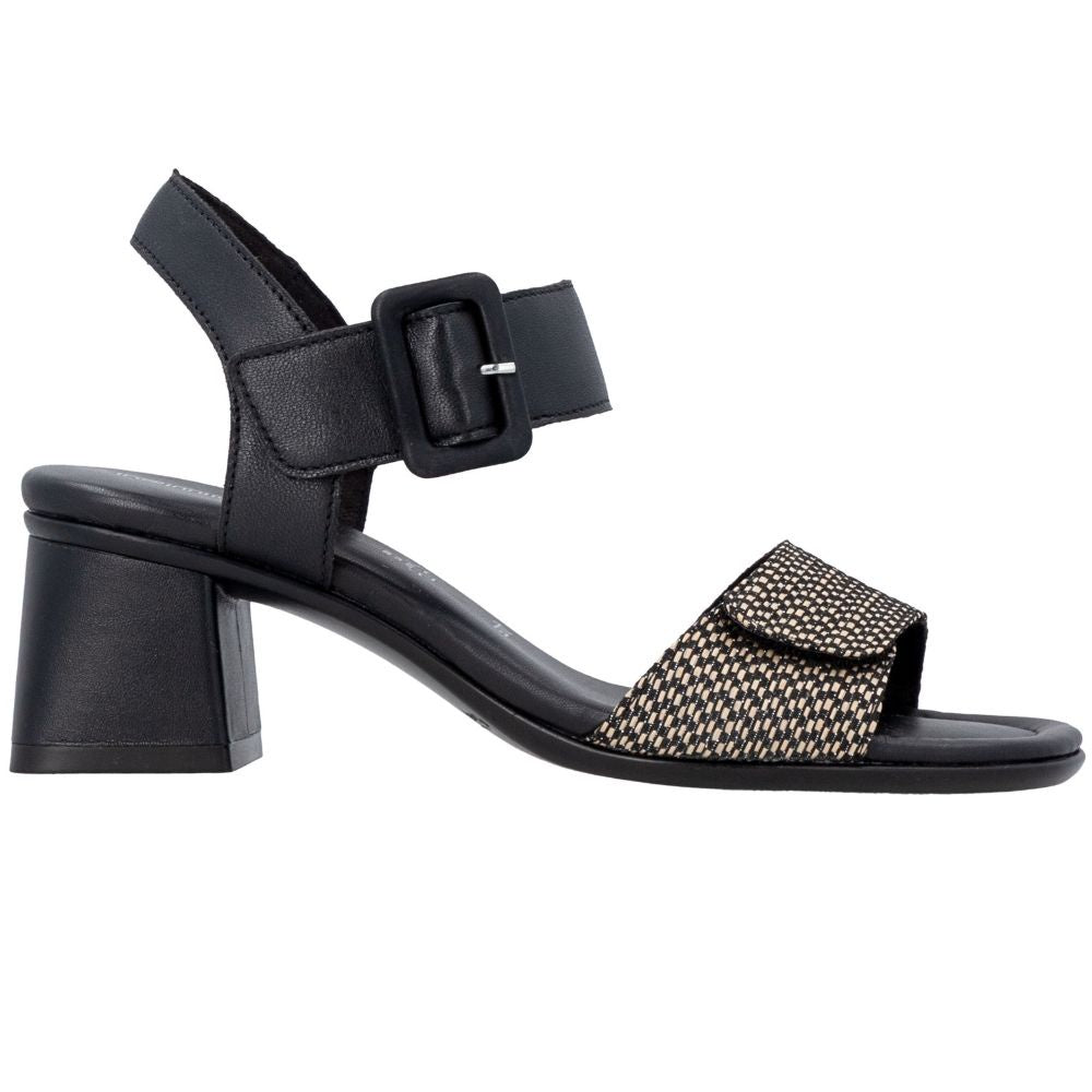 A black leather block-heel sandal with a wide ankle strap and a decorative woven toe strap in a black and beige geometric pattern, shown from a side profile on a white background.