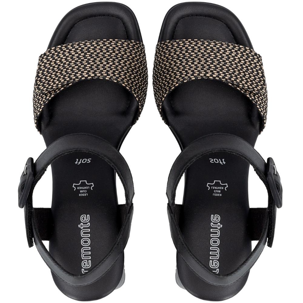 A pair of Remonte heeled sandals shown from a top-down view. The sandals feature a black platform sole and heel, a wide black strap with a textured beige woven pattern, and a black adjustable ankle strap with a buckle.