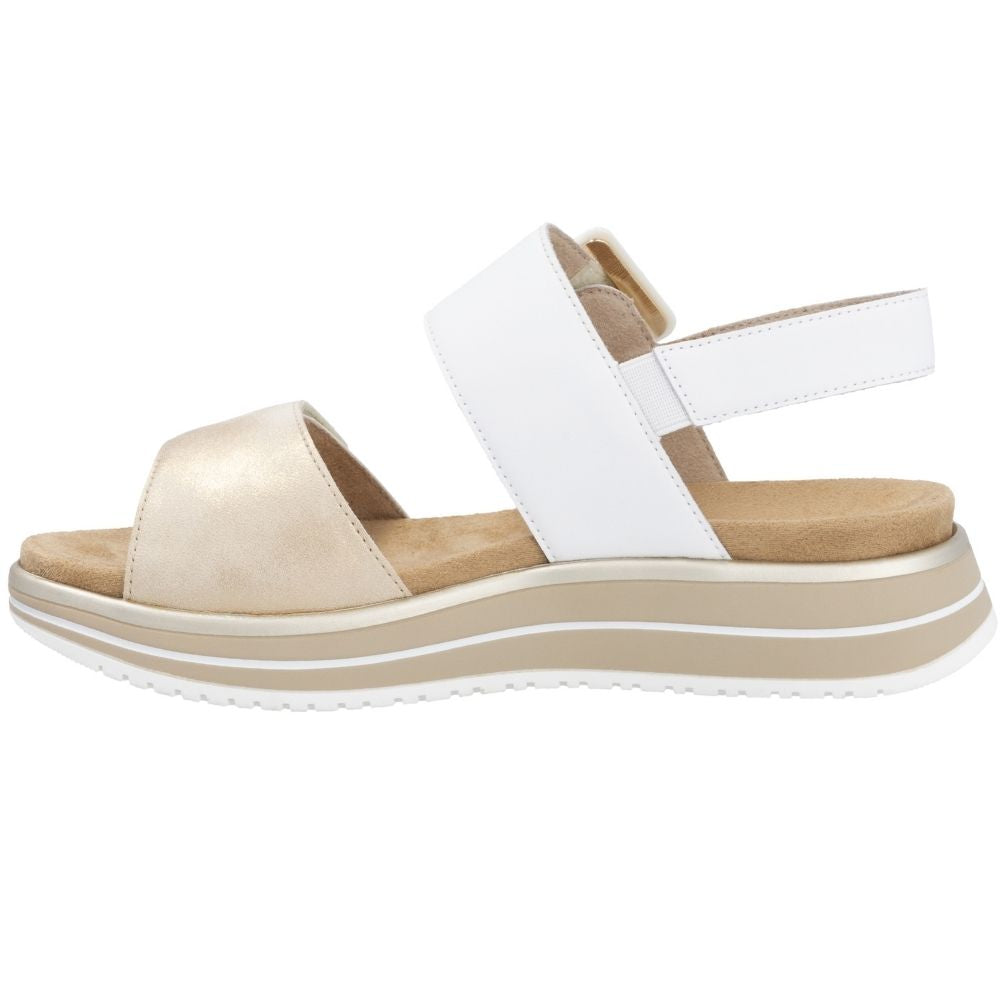 A platform wedge sandal with a wide white ankle strap, a pale gold leather toe strap, and a beige and white layered sole, shown from a side profile on a white background.