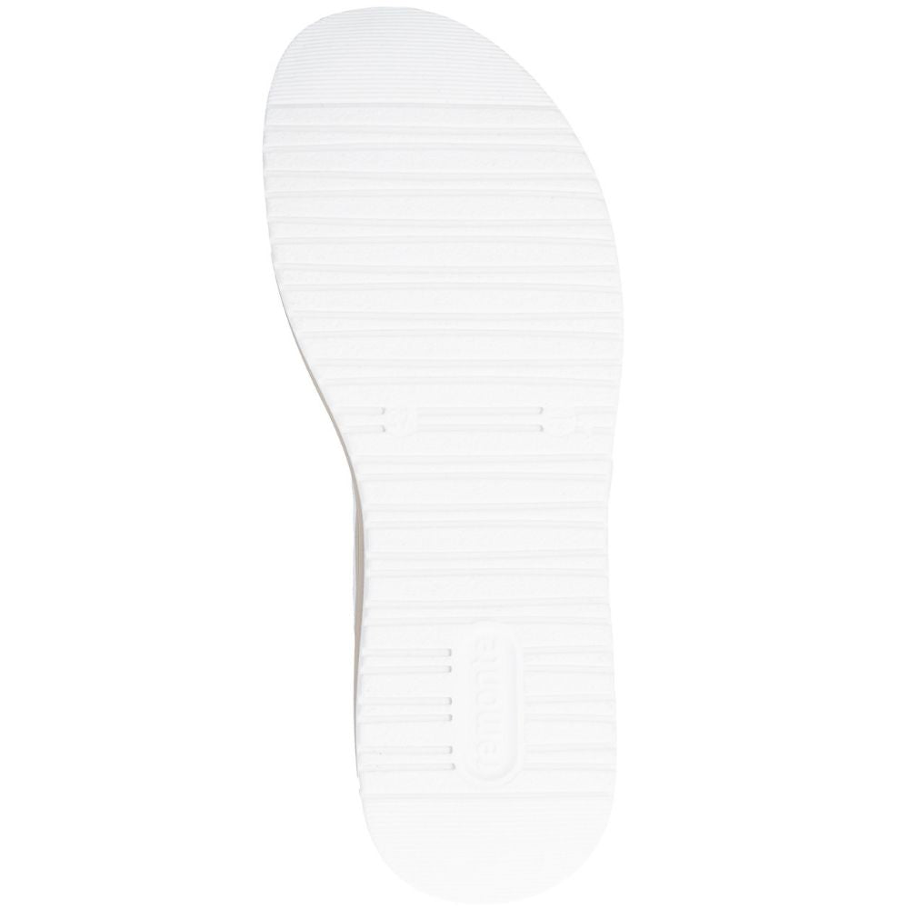 A top-down view of a white shoe sole with horizontal grooves and a subtle embossed logo near the heel, set against a plain white background.