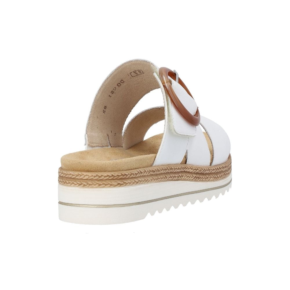 The back view of a single women's platform slide sandal in a white leather, featuring a statement amber buckle on the upper strap and a white platform sole with jute-look detailing.