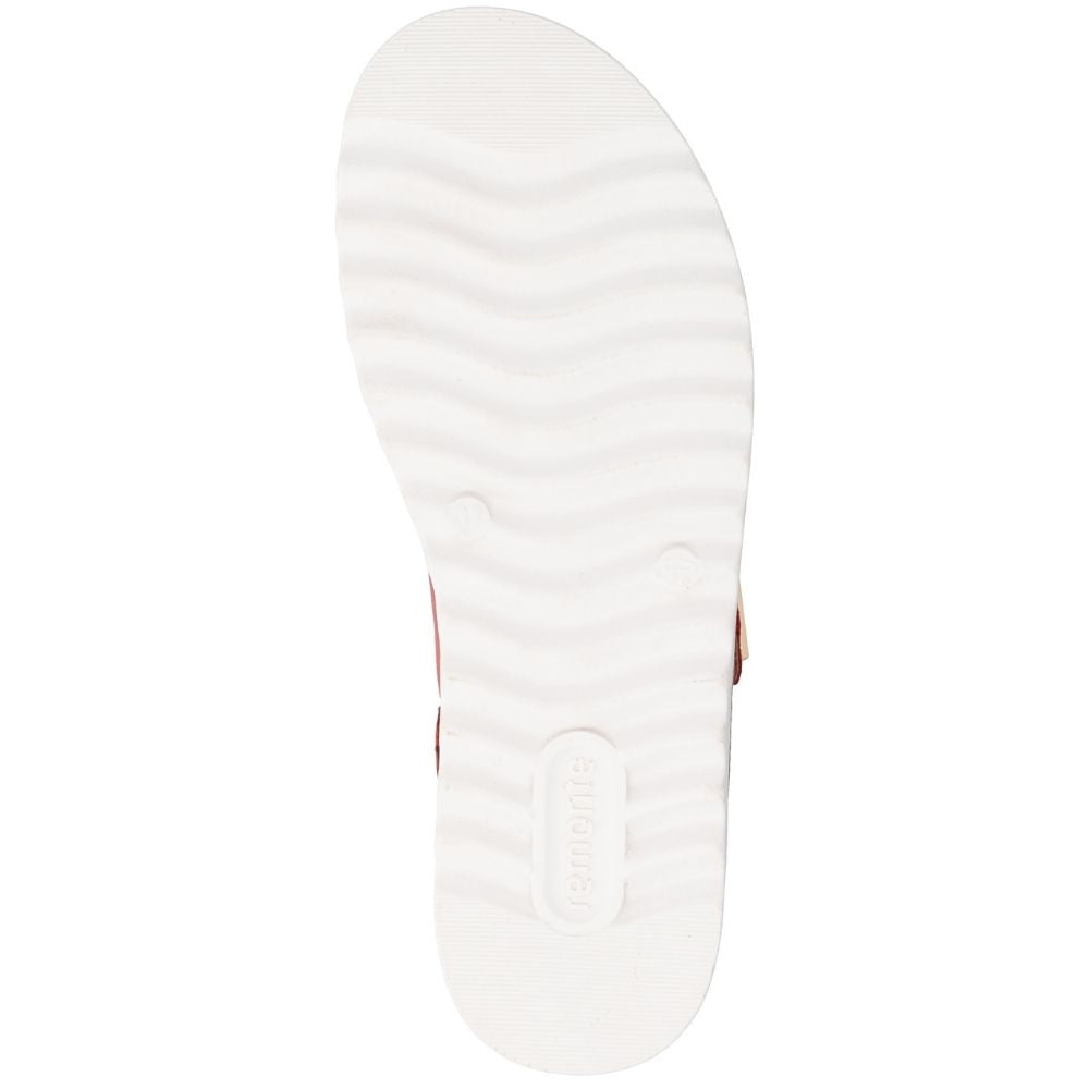 A top-down view of a white textured sole with wavy grooves and an embossed 'remonte' logo, shown on a plain white background.