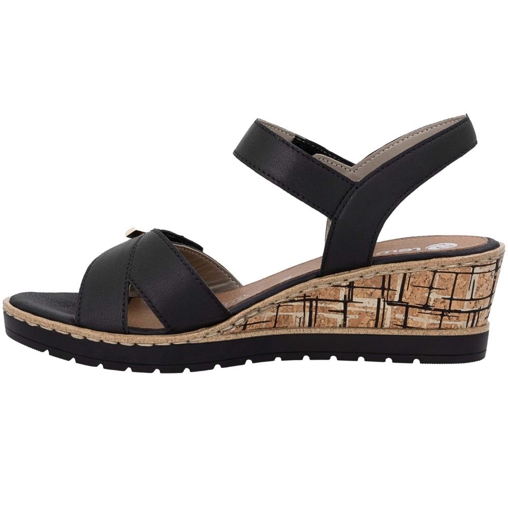A black wedge sandal with a woven cork-look midsole and a black outsole, shown from a side profile view on a white background.