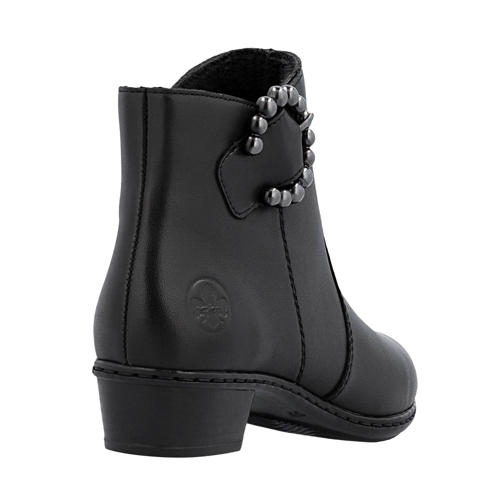Black leather boot with a decorative pewter buckle on a white background