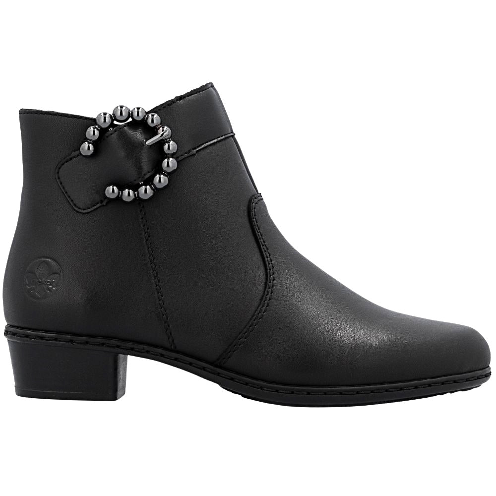 Black ankle boot with decorative pewter buckle on a white background