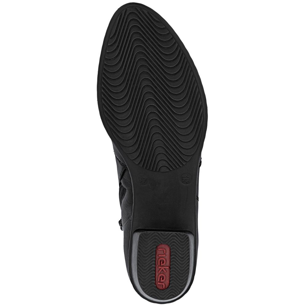 Black boot sole with tread pattern on a white background