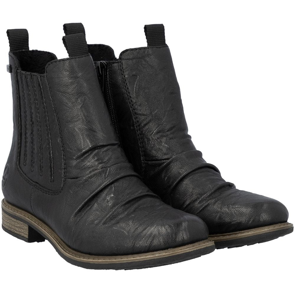 Pair of black leather boots on a white background