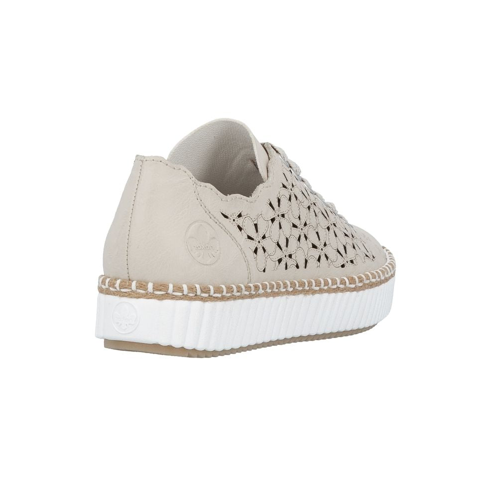 A low-top platform sneaker in light beige leather with geometric cutout detailing on the side, beige laces, and a thick white ribbed platform sole with a braided jute trim.