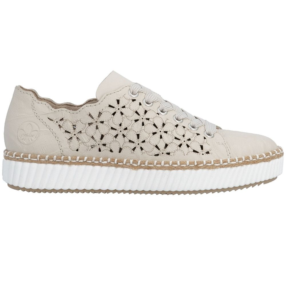 A low-top platform sneaker in cream leather with geometric cutout detailing on the side, beige laces, and a thick white ribbed platform sole with a braided jute trim.