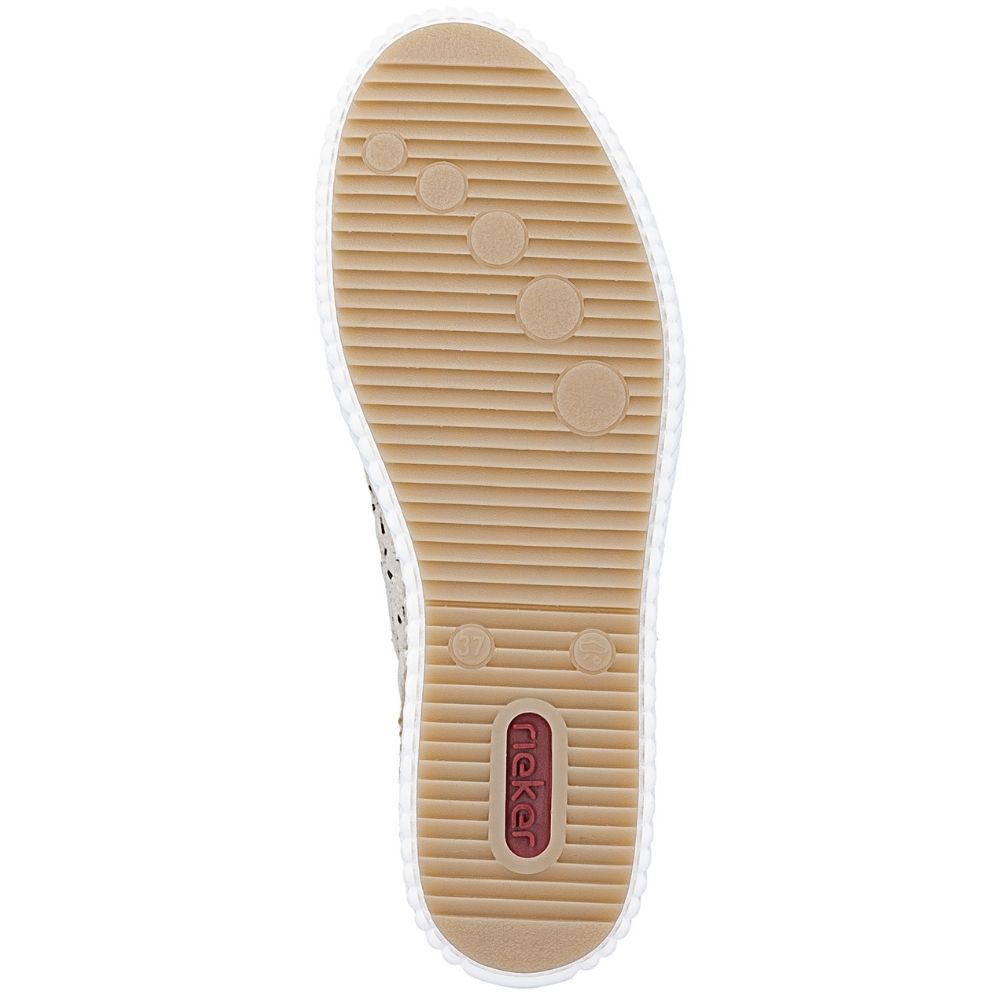 The outsole of a shoe shown from a top-down view, featuring a tan ribbed rubber sole with a small red 'RIEKER' logo badge near the heel.