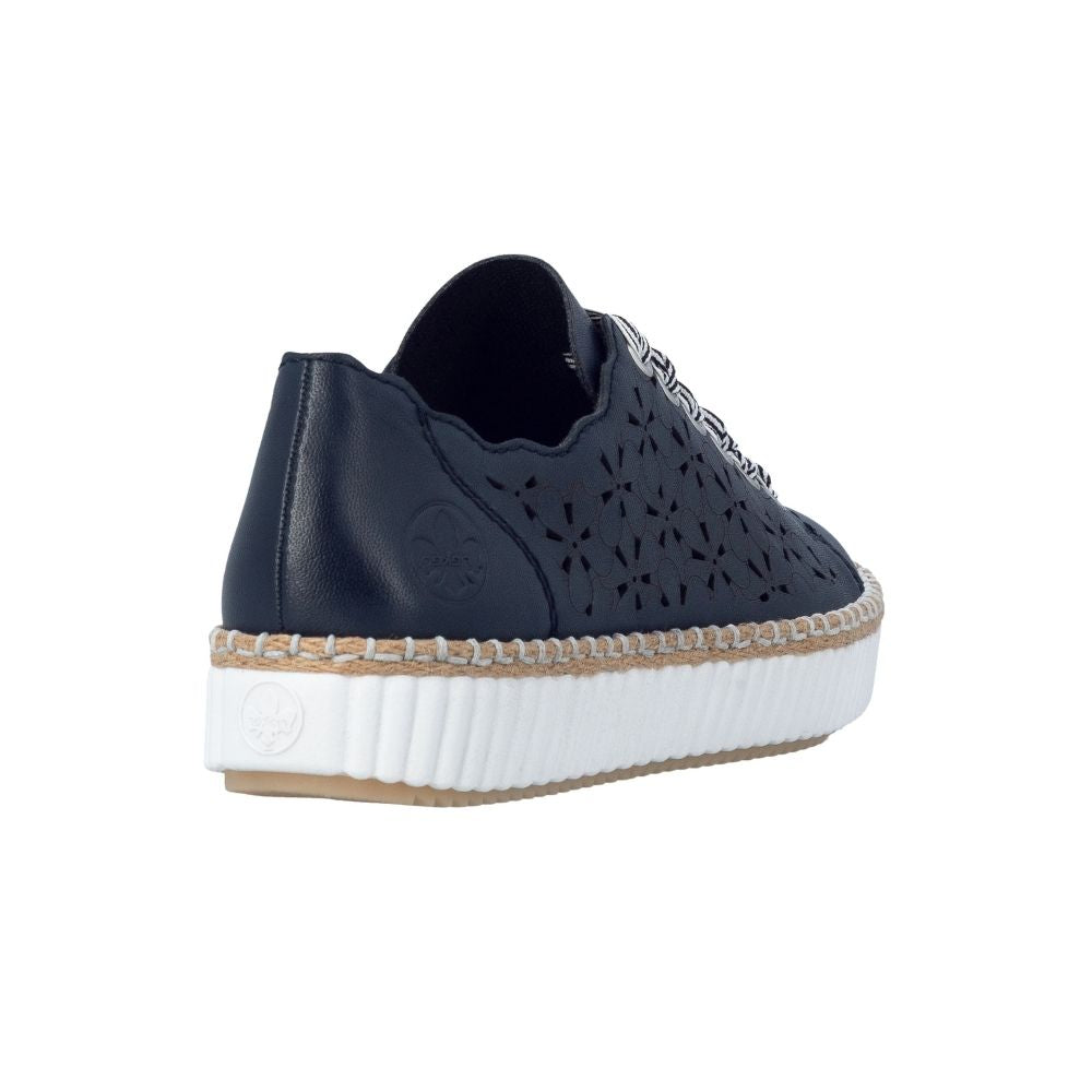 A navy-blue leather platform sneaker with laser-cut geometric patterns, a braided jute-wrapped trim, and a thick white ribbed platform sole.