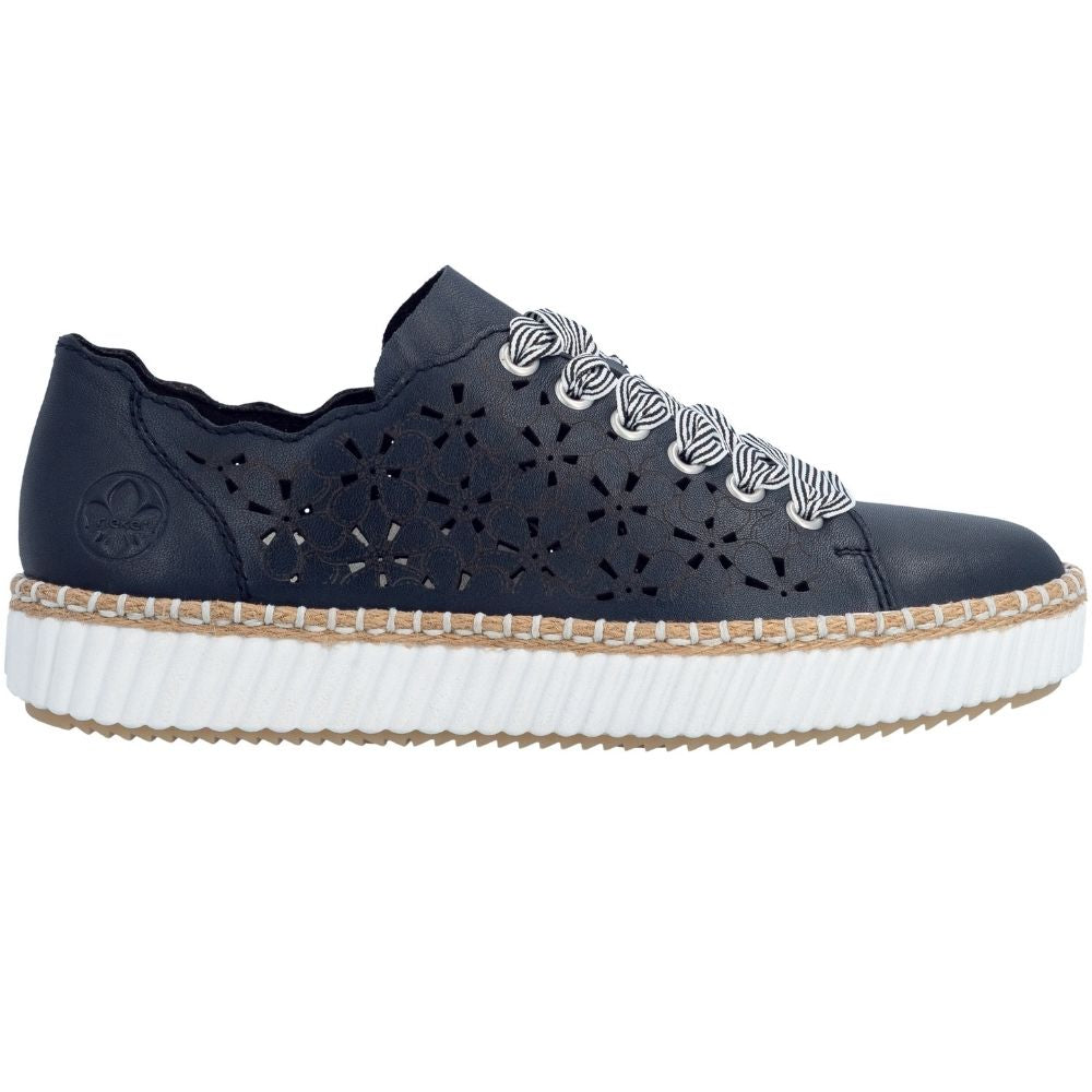 A navy-blue leather platform sneaker with laser-cut geometric patterns on the sides, featuring striped laces and a thick white ribbed platform sole with a jute-trimmed edge.