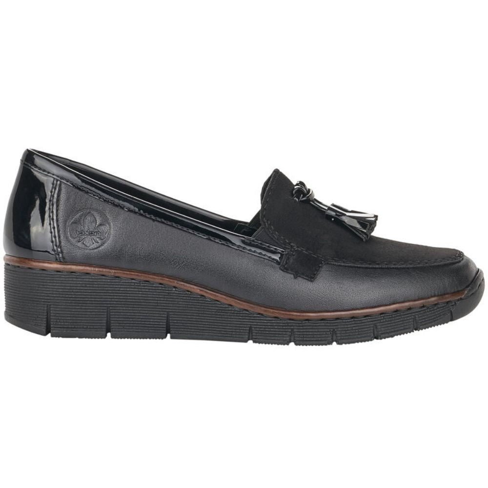 Black loafer shoe with a tassel on a white background