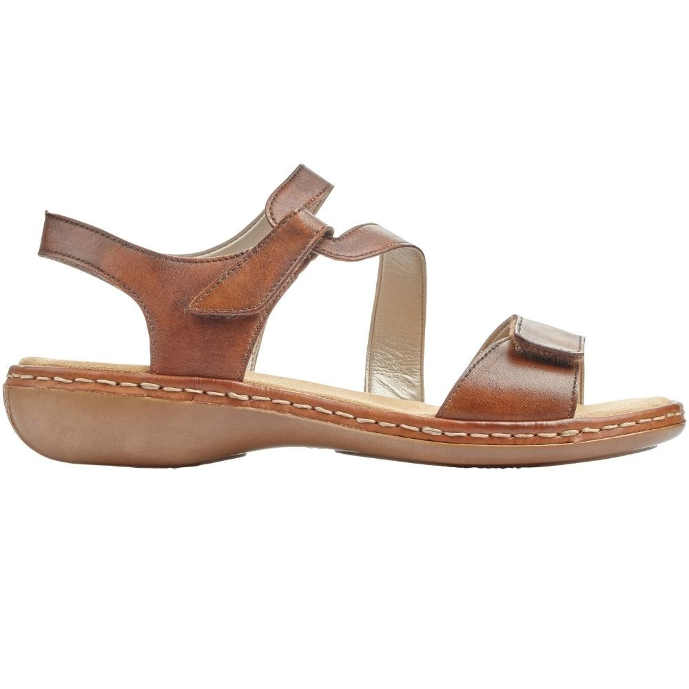 A tan leather strappy sandal with a low wedge heel, shown in a side profile view against a plain white background.