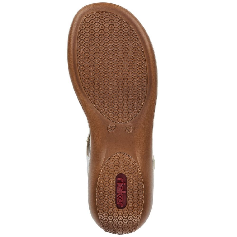A top-down view of a brown shoe sole, showing the textured tread pattern and a red 'Rieker' brand logo on the heel, set against a plain white background.