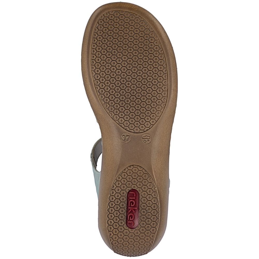 A top-down view of a brown sandal sole, showing a honeycomb tread pattern and a small red Rieker logo on the heel.