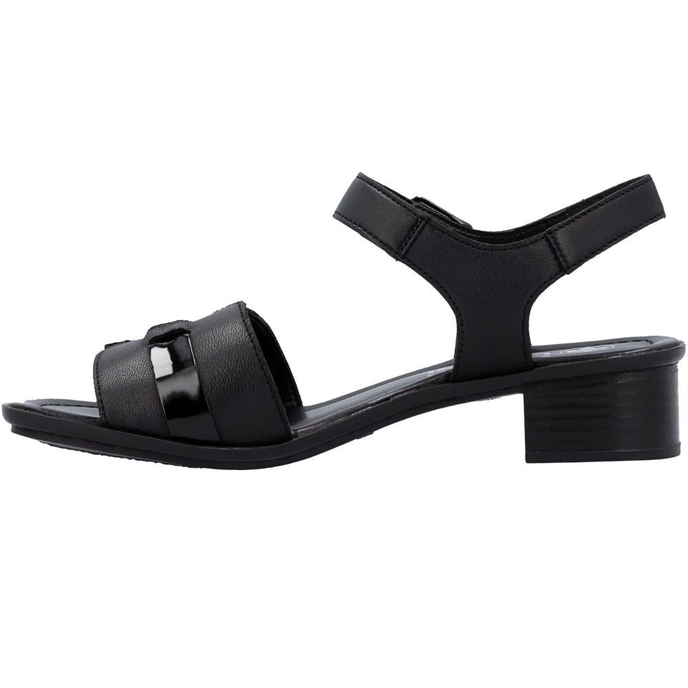 A black leather block-heel sandal with an adjustable ankle strap and a decorative patent leather accent on the front strap, shown in a side profile view against a white background.