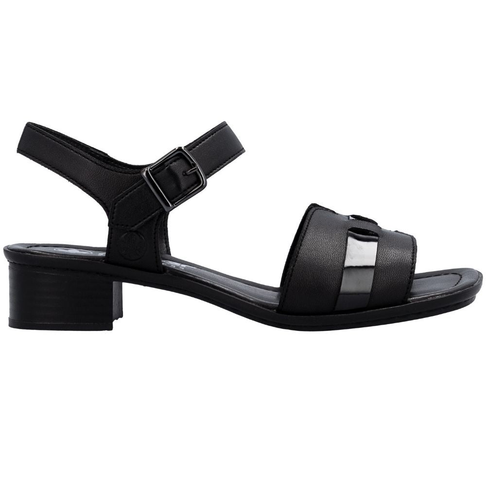 A black leather block-heel sandal with an adjustable ankle strap and a decorative patent leather accent on the front strap, shown in a side profile view against a white background.