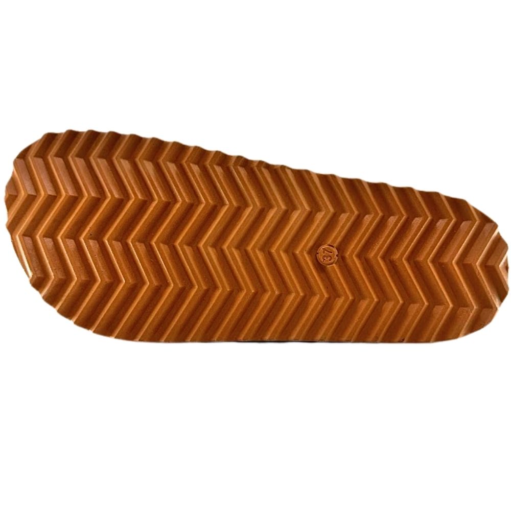 A close-up of a brown textured rubber sole with a chevron tread pattern, shown against a plain white background.