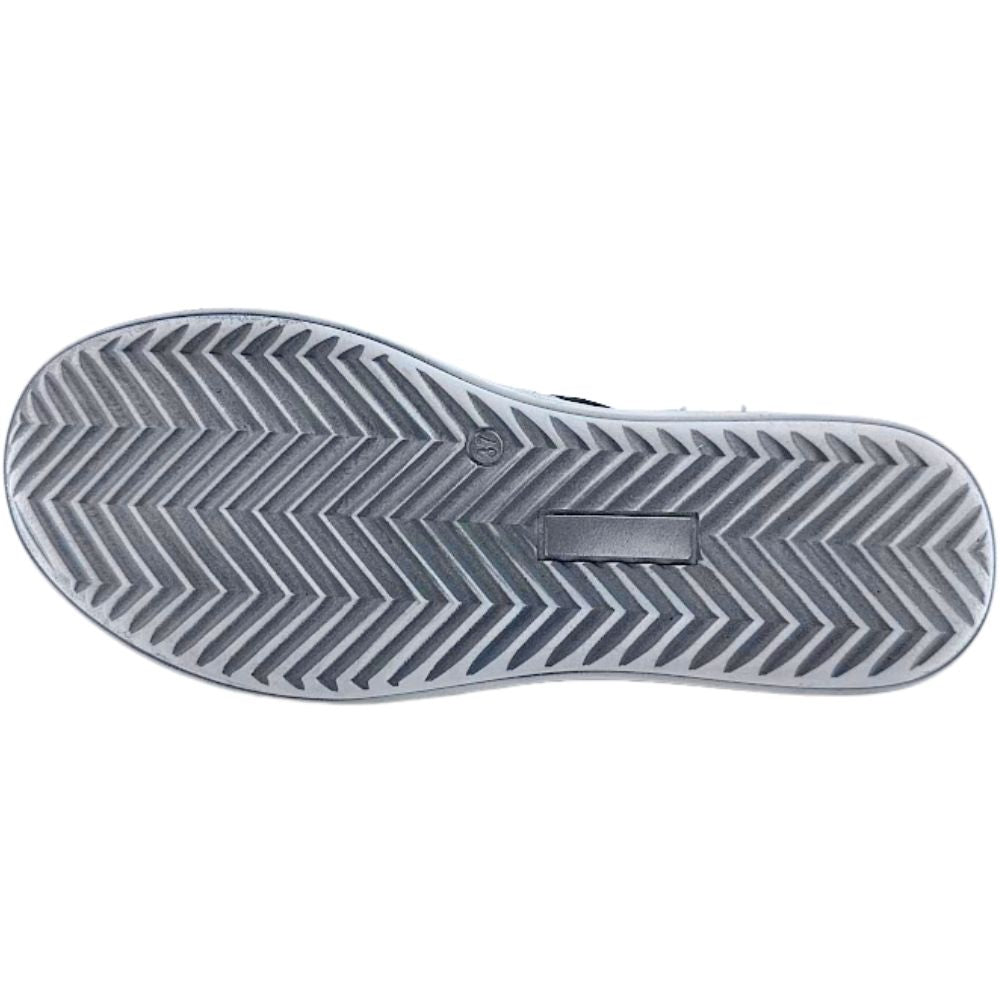 Close-up of a white sole with a zigzag pattern on a white background