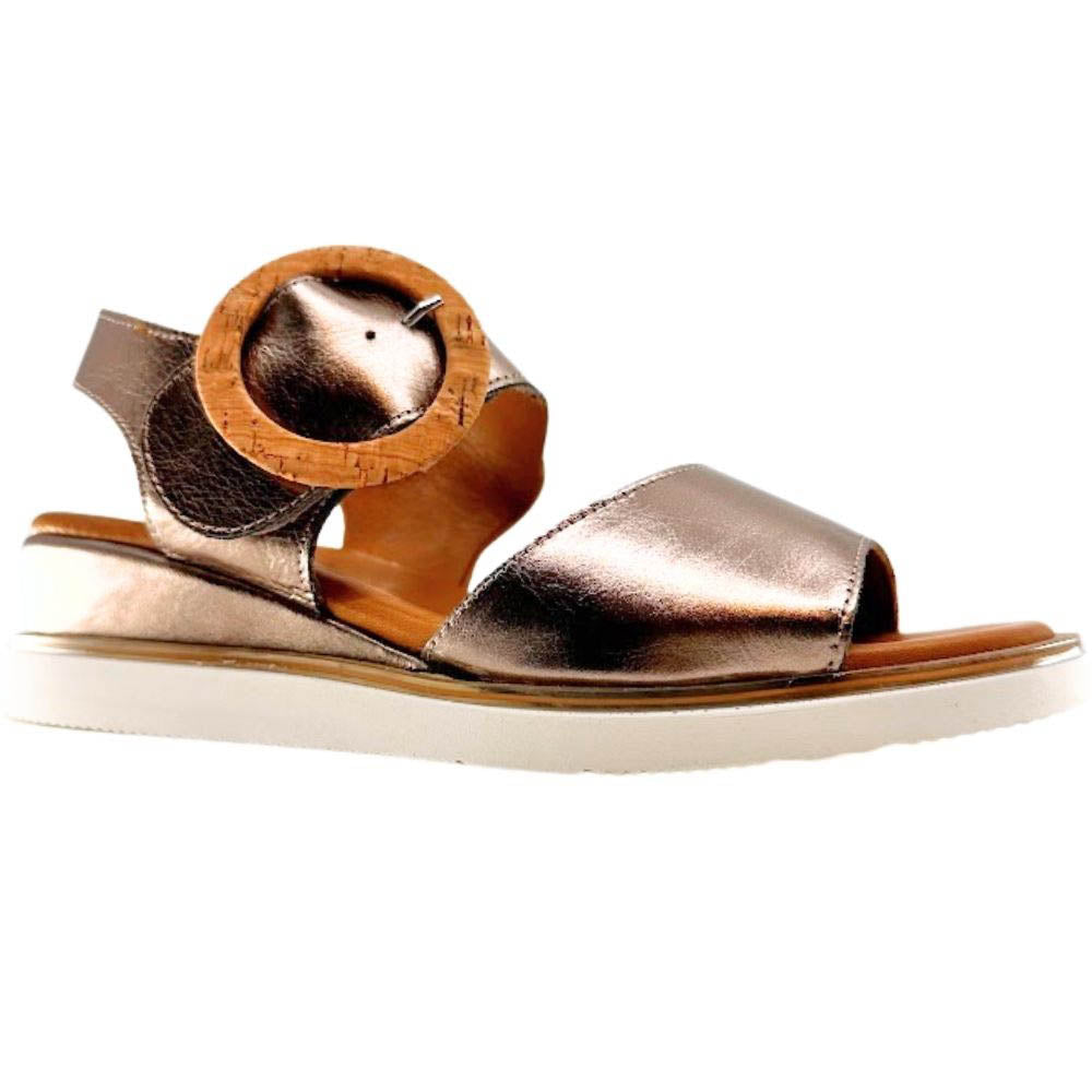A metallic bronze leather wedge sandal with a wooden circular buckle detail on the strap, shown in a side profile against a white background.
