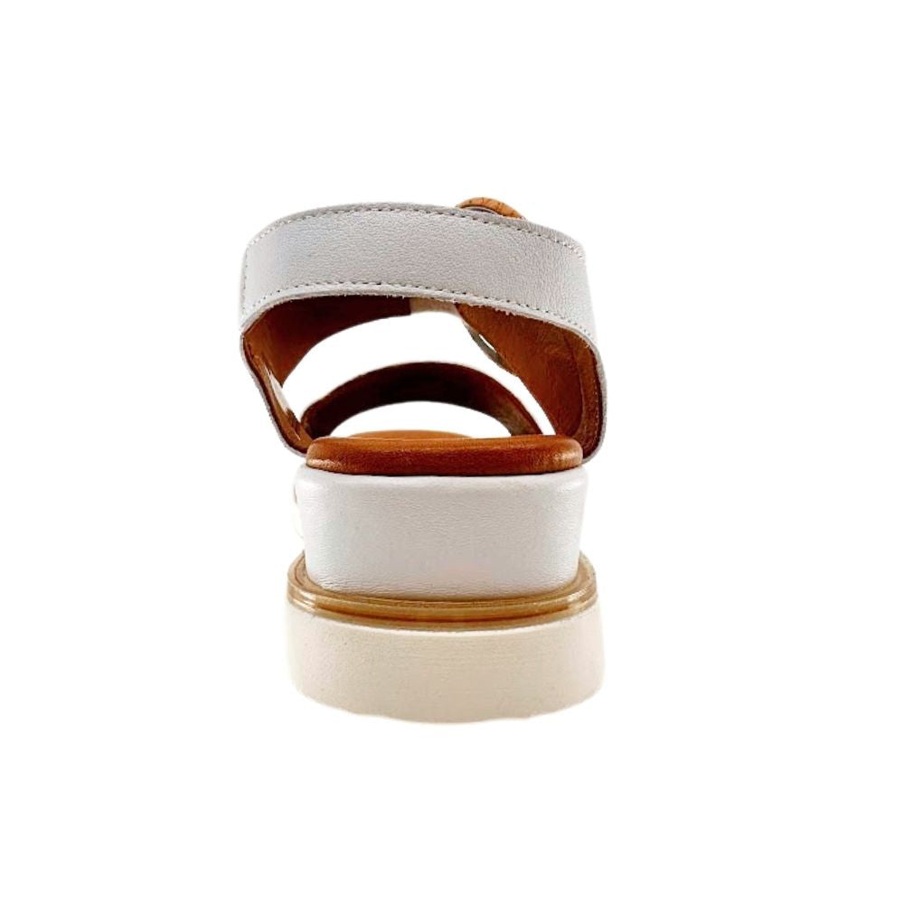A single white leather platform sandal with brown trim and lining, shown from a rear three-quarter view on a solid white background.