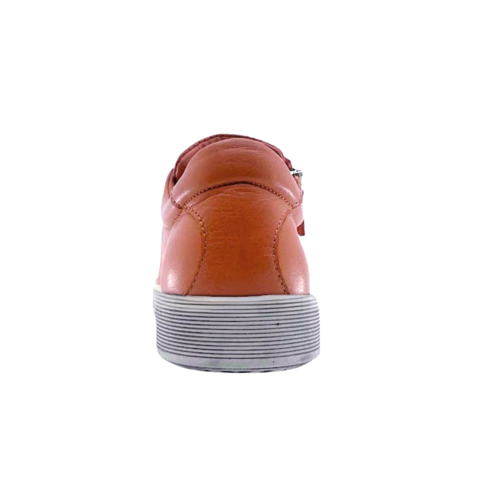 Organe leather shoe with a white sole on a white background