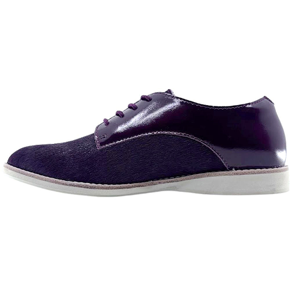 Cherry lace up shoe with white sole on a white background