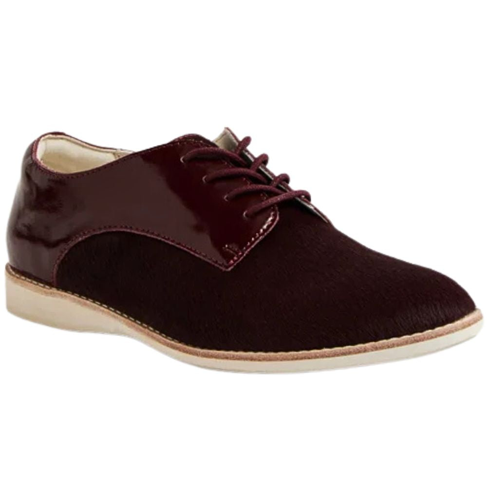 Cherry burgundy leather shoe with white sole on a white background