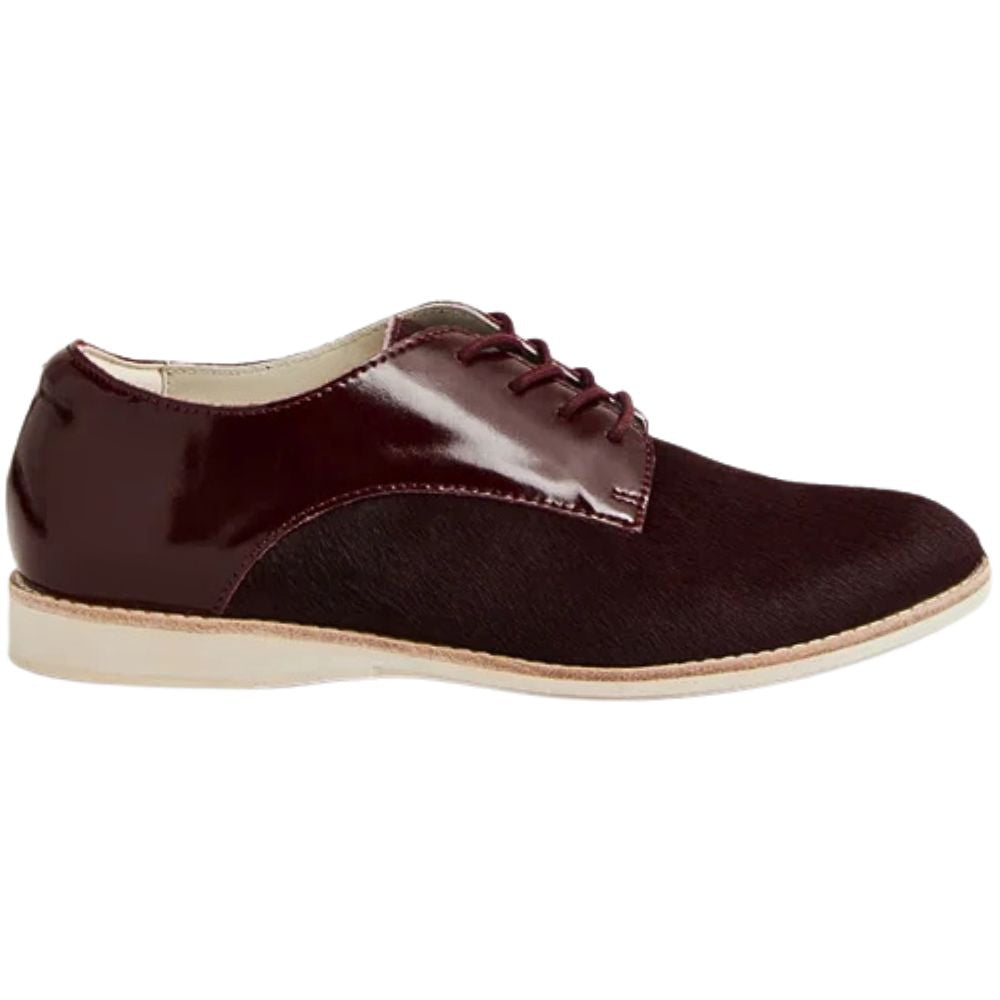 Cherry burgundy leather shoe with a white sole on a white background
